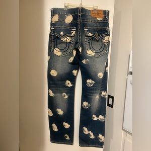 Used True Religion Jeans. Denim blue w cream color blotches throughout. 34 waist